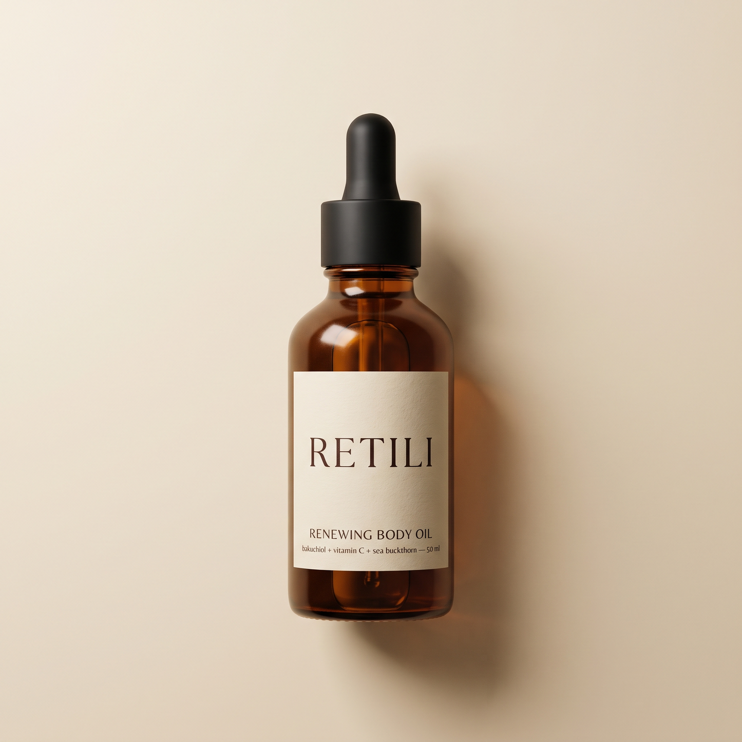 Retili Renewing Body Oil amber dropper bottle on cream background