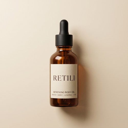 Retili Renewing Body Oil amber dropper bottle on cream background