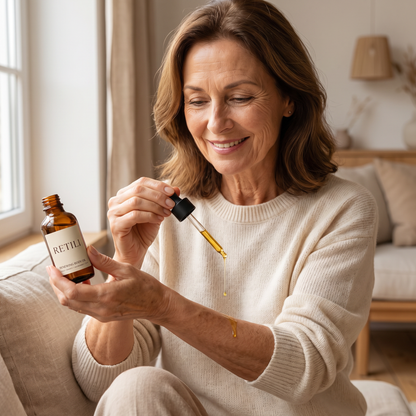 Woman applying Retili Renewing Body Oil to her forearm